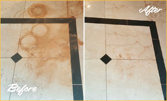 Before and After Picture of a Kangley Hard Surface Restoration Service on a Marble Floor to Eliminate Rust Stains